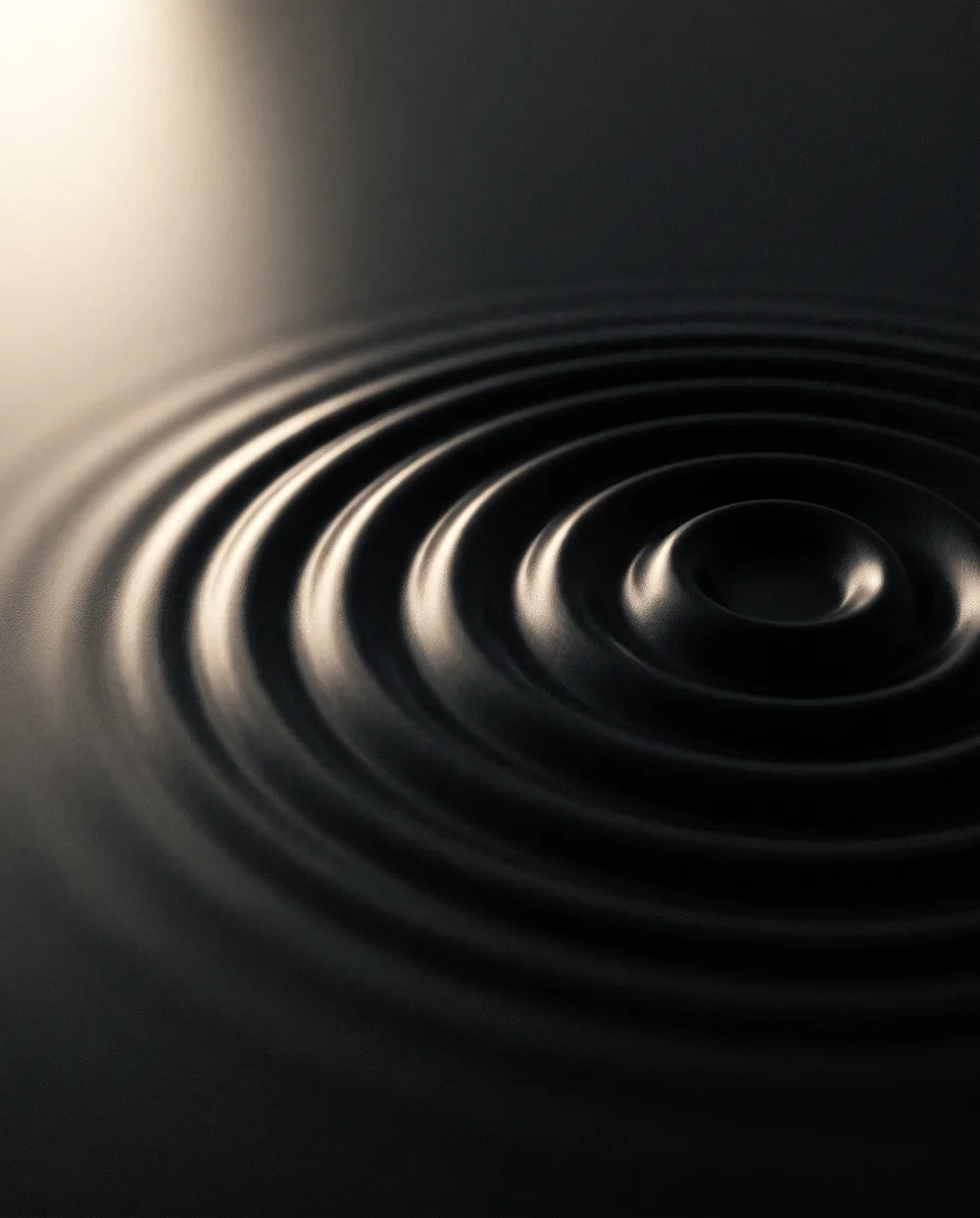 Abstract ripples in black liquid, representing listening